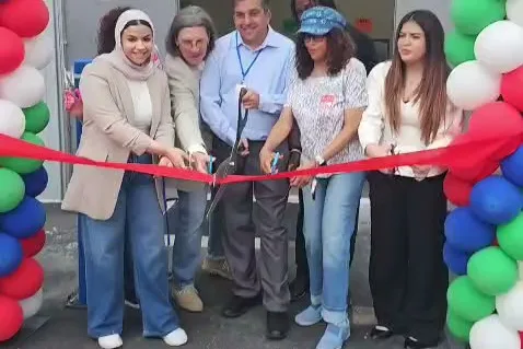 MMY leaders and guests cutting the ribbon at the new MMY Center, 2026