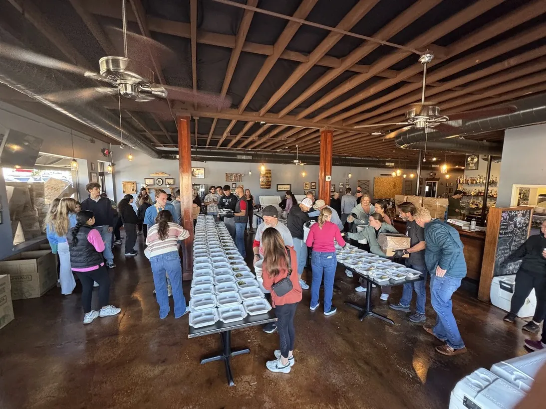 Volunteers packing Thanksgiving meals for Giving Thanks by Giving